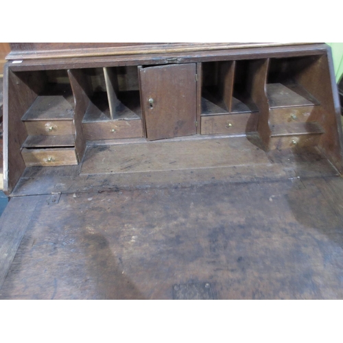 1187 - C18th oak bureau bookcase, the top with two inlaid panel doors, fitted interior with concealed well ... 