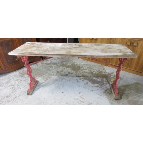 1191 - C20th conservatory table, with planked pine top on scroll and mask cast iron end supports, L165cm W5... 