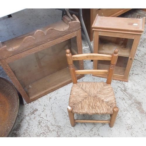 1686 - Glazed oak wall cupboard, similar glazed pine cupboard and a child's rush seat ladder back chair, W5... 