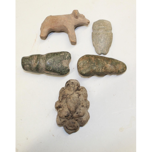 100 - A selection of four carved stone faces and figures of various styles and periods. To include a hand-... 