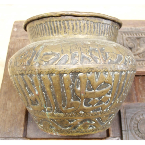 98 - A large brass vessel in the Mughal style, embossed with elephant imagery and Naskh script. Accompani... 