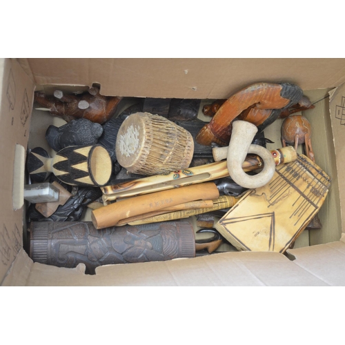 95 - A large collection of carved wooden items from across Africa, including turned plates and bowls, gob... 