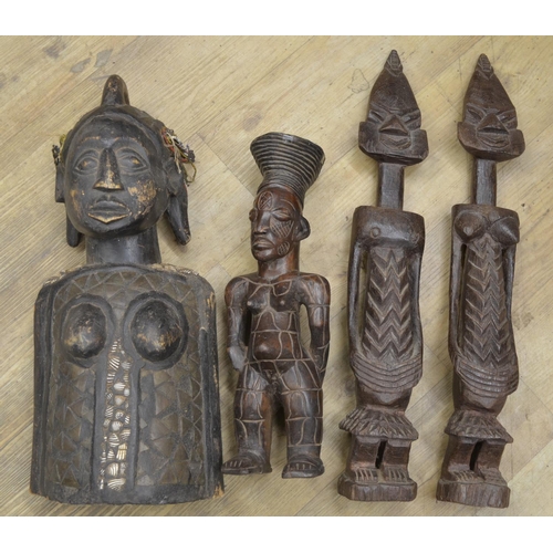 96 - A selection of four carved wooden figures originating from across the african continent. To include ... 