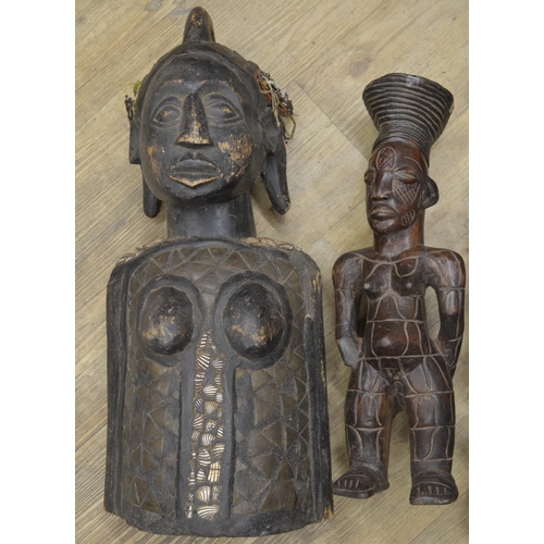 96 - A selection of four carved wooden figures originating from across the african continent. To include ... 