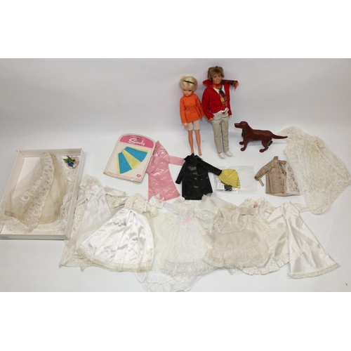 1713 - Early 1980s Sindy doll in orange top, later Paul doll, Sindy and Patch clothes and hat, and a large ... 