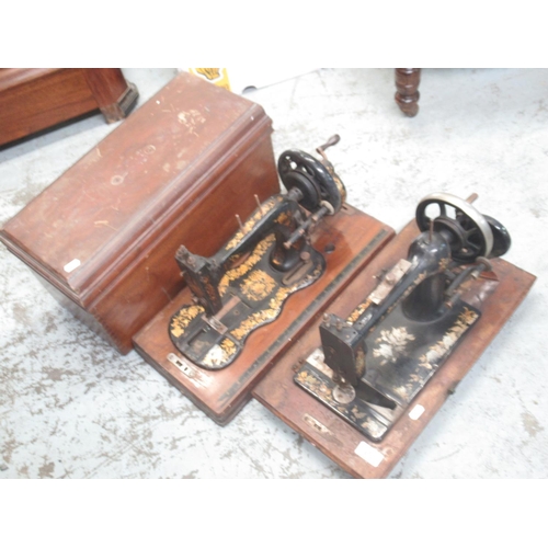 1673 - New National hand sewing machine, on wooden base and a similar unmarked sewing machine in wooden cas... 