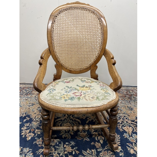 1320 - Victorian rocking chair, bergere back panel, circular seat with upholstered seat pad, H89cm