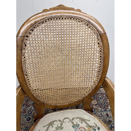 1320 - Victorian rocking chair, bergere back panel, circular seat with upholstered seat pad, H89cm