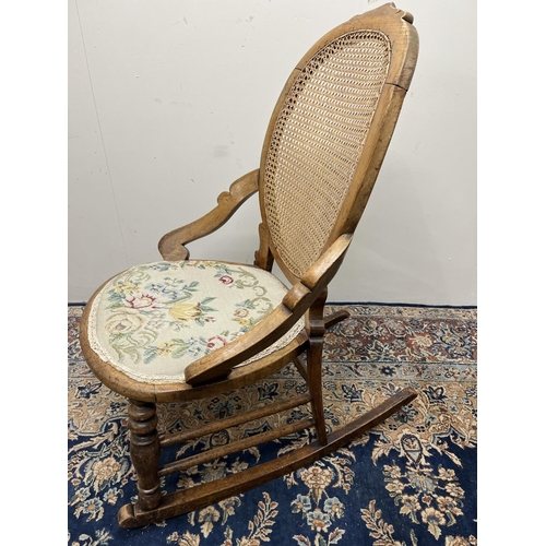 1320 - Victorian rocking chair, bergere back panel, circular seat with upholstered seat pad, H89cm