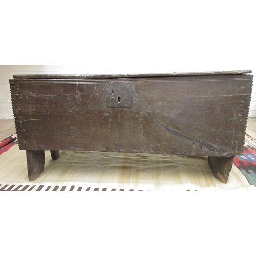 975 - Large 18th century planked oak coffer with pegged base and chip carved detail, W136cm D46cm H68cm (V... 