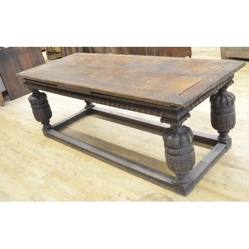 973 - Elizabethan style oak rectangular refectory draw leaf dining table, with lobed frieze on cup and cov... 