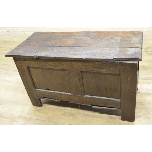 978 - 18th century oak coffer with spilt pin hinged top, three panel front with strapwork carved frieze an... 