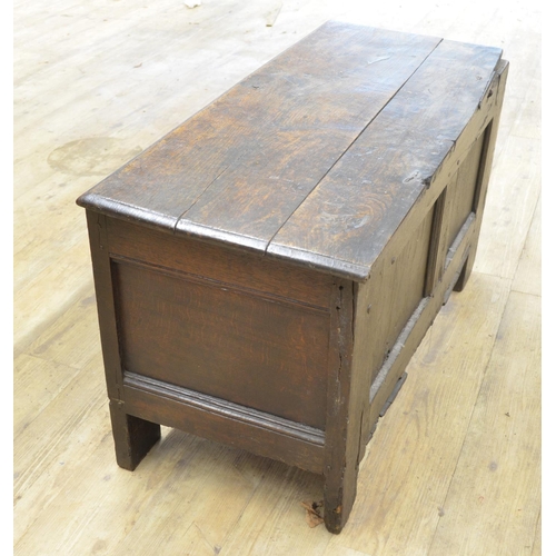 978 - 18th century oak coffer with spilt pin hinged top, three panel front with strapwork carved frieze an... 