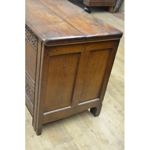 981 - 18th century oak coffer, hinged lid with incised line detail, panel front carved with lunettes, stra... 