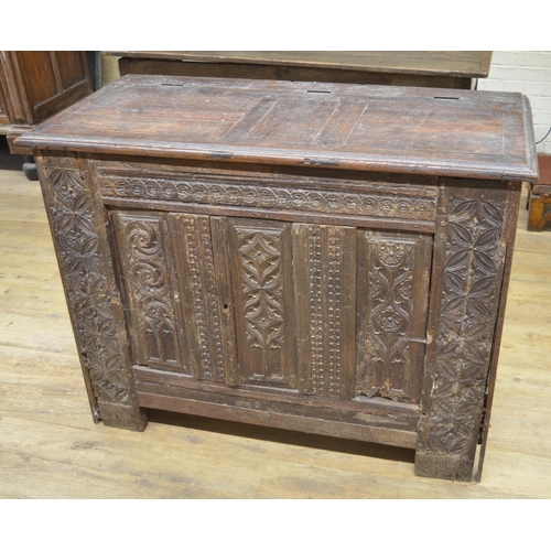 984 - 18th century French oak side cabinet, hinged top above two doors carved with strapwork, W129cm D63cm... 