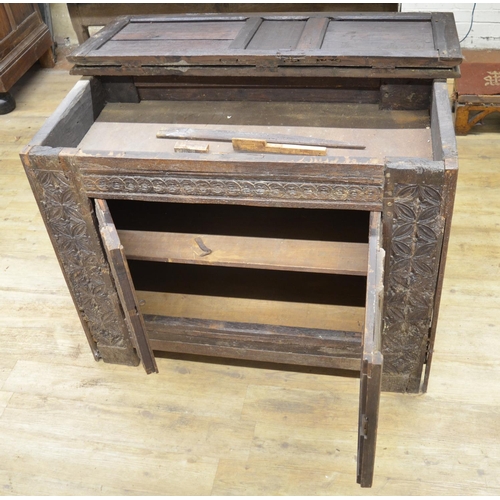 984 - 18th century French oak side cabinet, hinged top above two doors carved with strapwork, W129cm D63cm... 