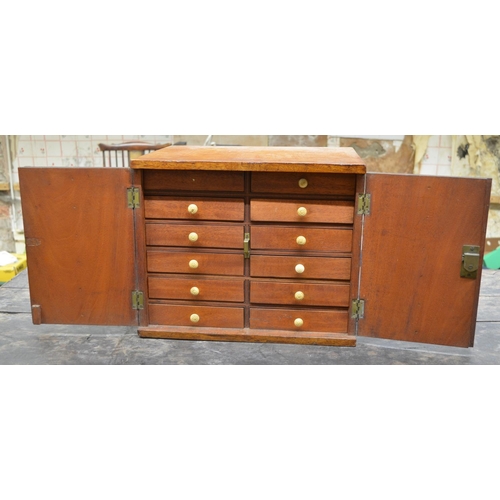 987 - Victorian mahogany collectors cabinet, two doors enclosing twelve short drawers, W38cm D30cm H31cm (... 