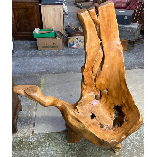 1685 - Large yew driftwood tree trunk chair with natural features and drinks arm. Height approx 170cm