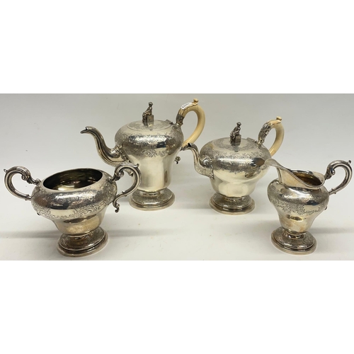 William IV silver four piece pear shaped coffee and tea service, chased Chinoiserie decoration, the tea and coffee pot with ivory handles and figural Chinese finials, by J.E. Terry & Co, London, 1836, H22cm max (4) Ivory Exemption Reference: VHXNKWJ9