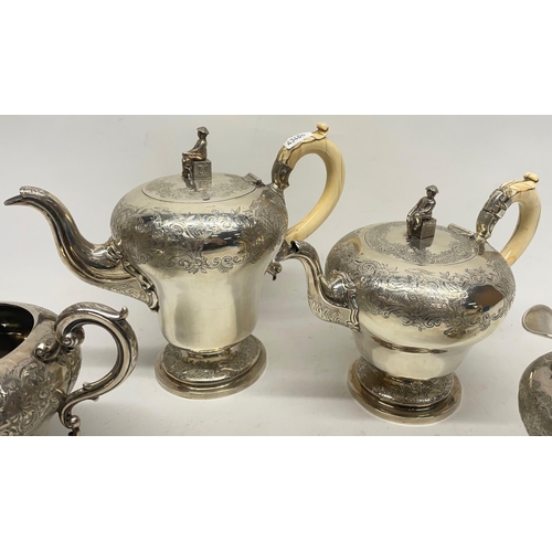 1035 - William IV silver four piece pear shaped coffee and tea service, chased Chinoiserie decoration, the ... 