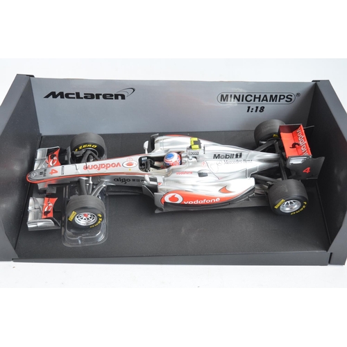 54 - Four boxed 1/18 scale Formula 1 racing car models from Paul's Model Art/Minichamps, all McLaren Merc... 
