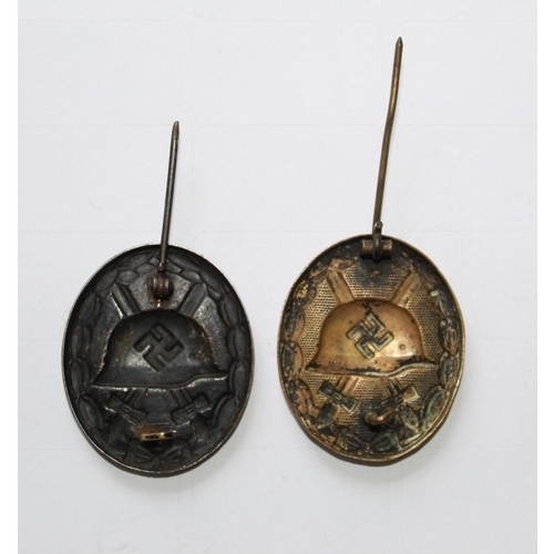 236 - Two WWII Wound Badges, in very good condition with both pins intact.