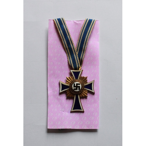 237 - Gold Mothers Cross 1st Class. In excellent condition with long ribbon and engraving to back.