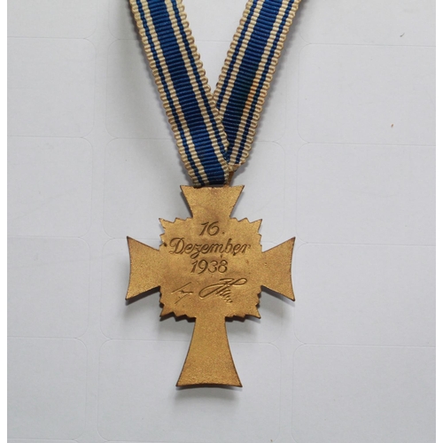 237 - Gold Mothers Cross 1st Class. In excellent condition with long ribbon and engraving to back.