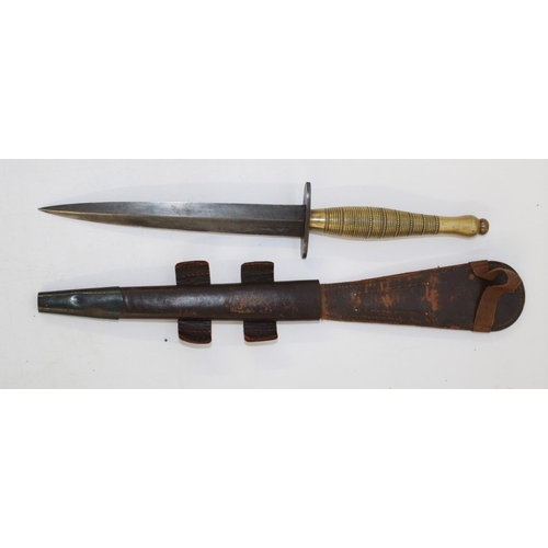 253 - Fairbairn-Sykes commando knife with ribbed and beaded brass grip, complete with sheath, No. 7 and br... 