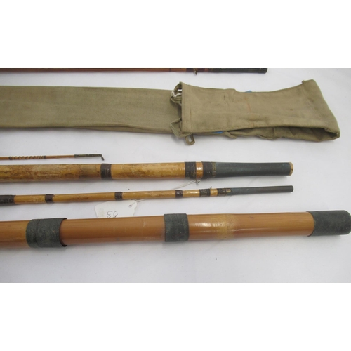 268 - A pair of vintage fishing rods. To include a split cane three-section fly rod sold by the A.W. Gamag... 