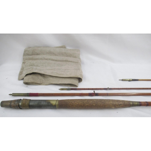 268 - A pair of vintage fishing rods. To include a split cane three-section fly rod sold by the A.W. Gamag... 