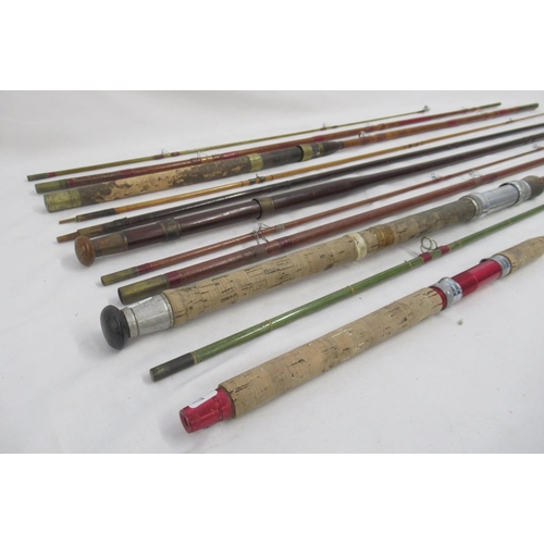 265 - Selection of four vintage fishing rods, all with signs of age-related wear. To include two unmarked ... 