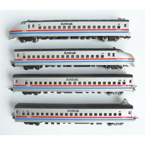 87 - HO gauge Model Power Amtrak bullet train with power and dummy cars plus 2 coaches, all boxed with mo... 