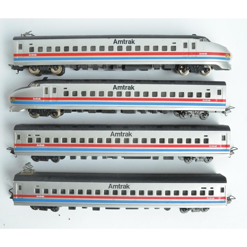 87 - HO gauge Model Power Amtrak bullet train with power and dummy cars plus 2 coaches, all boxed with mo... 