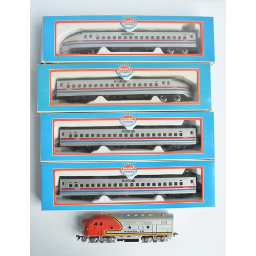 87 - HO gauge Model Power Amtrak bullet train with power and dummy cars plus 2 coaches, all boxed with mo... 