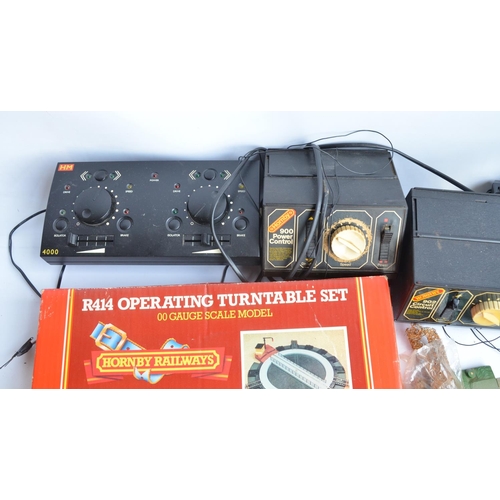 90 - Collection of used OO gauge model railway accessories to include power controllers, track, a Hornby ... 