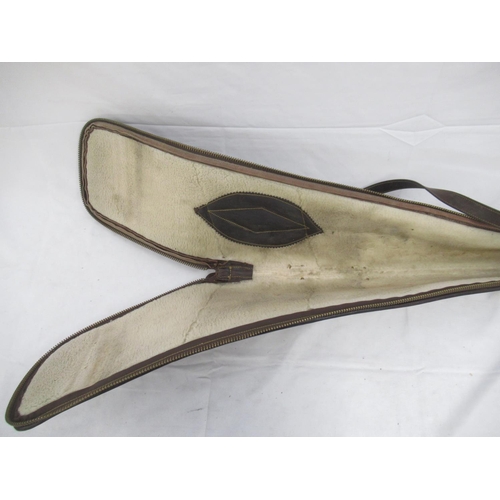 283 - Hawk Eye wool-lined leather gun slip with decorative stitching, with zip in good working order. With... 