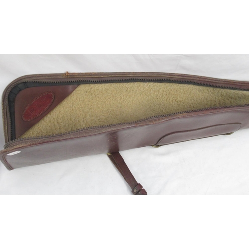 284 - Powell and Son wool-lined leather gun slip. With light age-related scuffing to extremities and minor... 