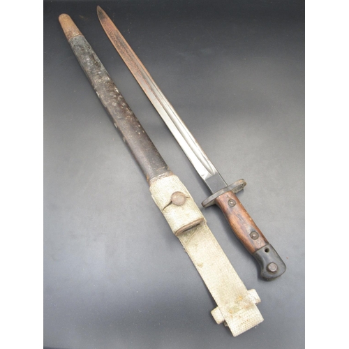 259 - British 1907 pattern bayonet, manufactured by Vickers. Complete with original scabbard and canvas be... 