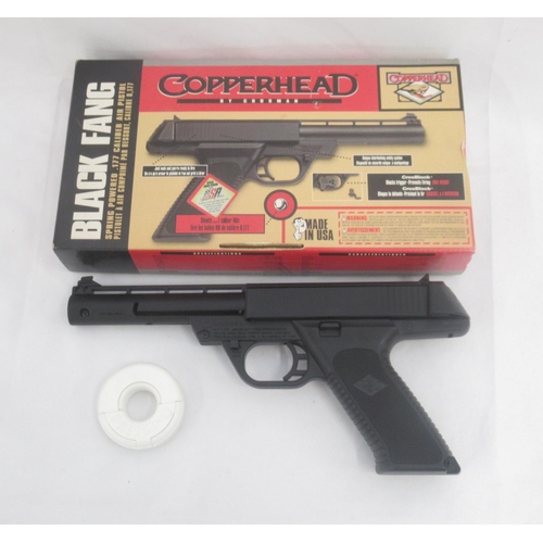 323 - Copperhead Black Fang spring powered .177 caliber air pistol, with metal BB pellets in white donut s... 