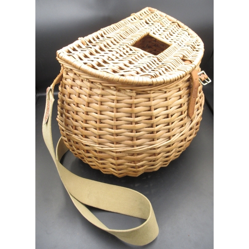 292 - Vintage wicker fly-fishing basket in excellent condition, with leather fasteners and a canvas carryi... 