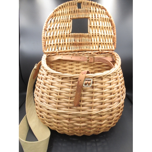 292 - Vintage wicker fly-fishing basket in excellent condition, with leather fasteners and a canvas carryi... 