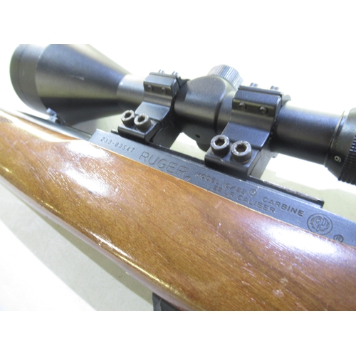 444 - Ruger 10/22 Semi Auto .22 calibre carbine, with fitted moderator and telescopic sight. Serial number... 