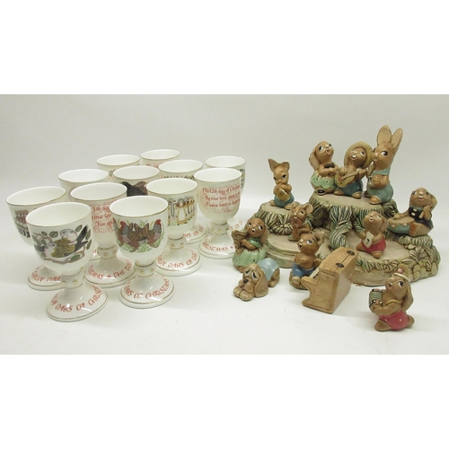 131 - Royal Doulton 12 Days of Christmas Goblets, and a collection of Pendelfin figures with display stand... 