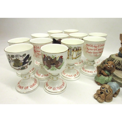 131 - Royal Doulton 12 Days of Christmas Goblets, and a collection of Pendelfin figures with display stand... 