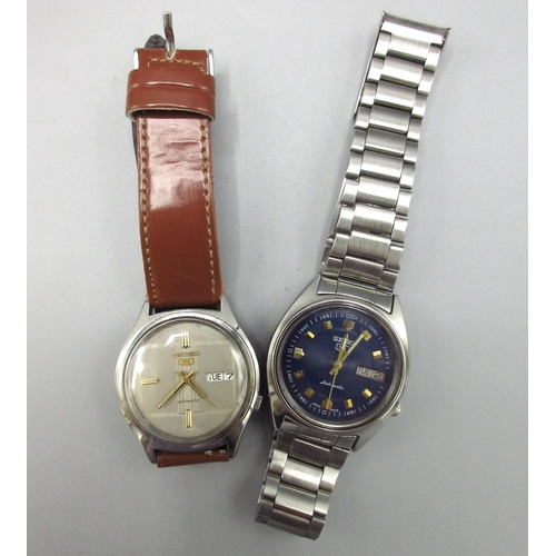 506 - Two Seiko 5 7009 Middle Eastern and European market stainless steel automatic wristwatches with day ... 