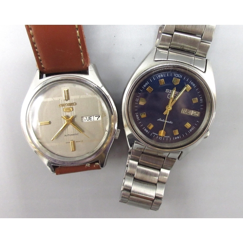 506 - Two Seiko 5 7009 Middle Eastern and European market stainless steel automatic wristwatches with day ... 