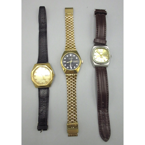 517 - Two Citizen Middle Eastern market gold plated automatic wristwatches with day date, nos. 01101270 an... 