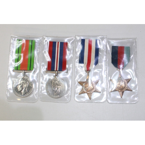 223A - A selection of four medals. To include a France and Germany Medal, a 1939-1945 Star, a George VI Dis... 