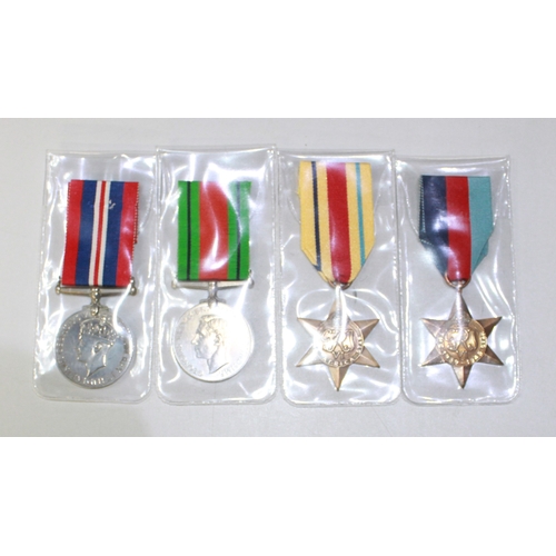 223B - A selection of four medals. To include the Defence Medal, the Africa Star, the 1939-1945 Star, and a... 